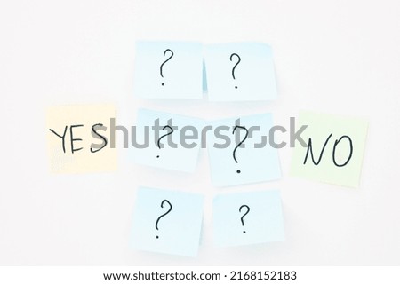 top view of cards with question mark above yes and no words on white background