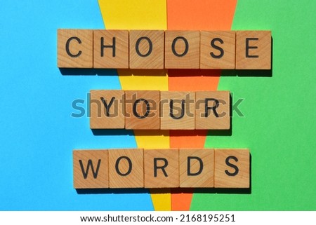 Choose Your Words, phrase in wooden alphabet letters isolated on multicolour background