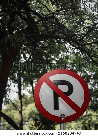 traffic sign with no parking symbol on the road 