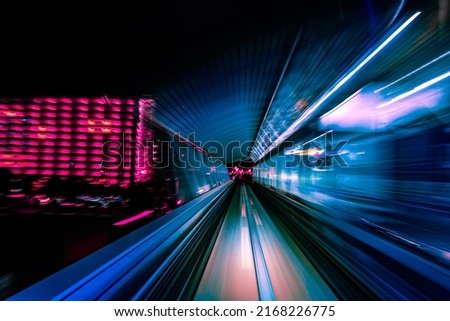 Long exposure motion blur from Yurikamome Monorail line in Tokyo, Japan. Abstract for Digital, Metaverse Technology, Futuristic Transportation, Computer Network, and Communication concept. Royalty-Free Stock Photo #2168226775