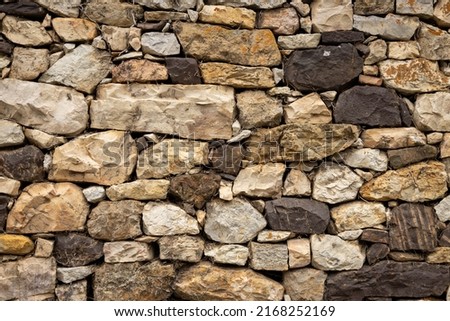 Old stone wall. irregular wall. Resource for designers. Stone abstract background.