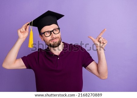 Photo of young guy look indicate finger empty space direct proposition bachelor isolated over violet color background