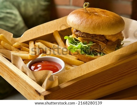 Cheese burger with sweet potato fries, beef burger with noses, and chicken burger