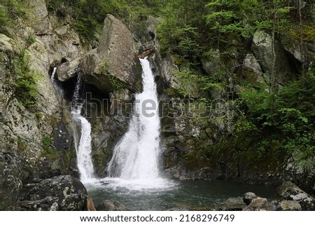 Water races down the mountain at Bash Bish Falls Royalty-Free Stock Photo #2168296749