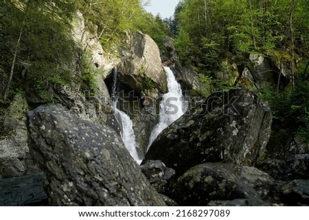 Rocks and boulders frame the majestic waterfall at Bash Bish Falls Royalty-Free Stock Photo #2168297089