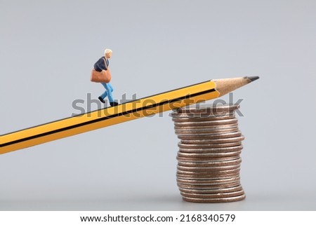 Miniaturized creativity goes in the direction of money Royalty-Free Stock Photo #2168340579