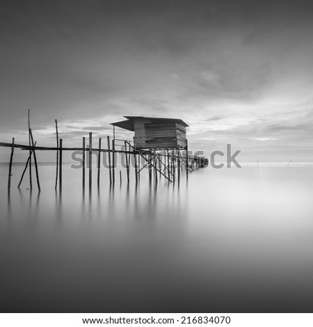 black and white image of fishing Jetty and houseboat