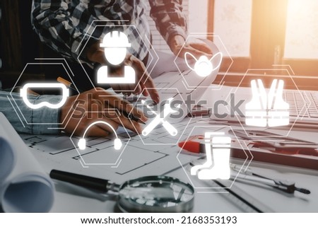 Work safety concept, Construction team worker working in office with VR screen Work safety icon, First secure rules. Health protection, personal security people on job.  Royalty-Free Stock Photo #2168353193