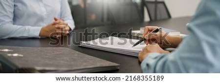Resignation concept, Executive signing on resignation letter of female employee when quit job.