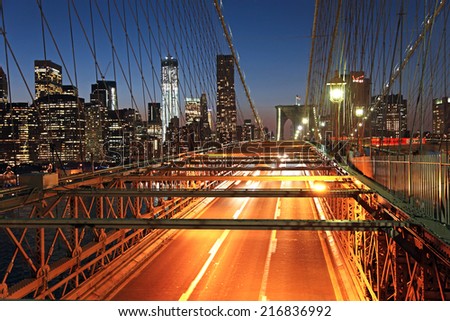 Brooklyn Bridge road lit up at night