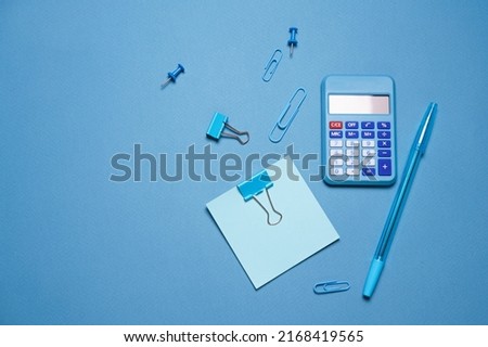 School objects, office supplies, tools and accessories isolated on blue background. Education concept