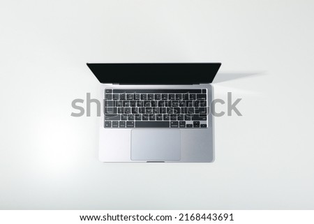 Open laptop on white background, top view Royalty-Free Stock Photo #2168443691