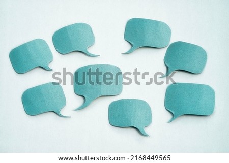 Group of blue paper speech bubbles with copy space