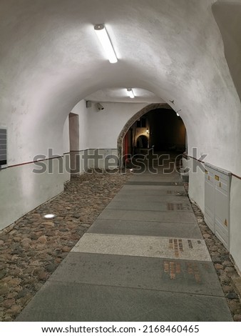 Arched passage on one of the narrow streets of Old Tallinn. Spring evening. Wanalynn area.