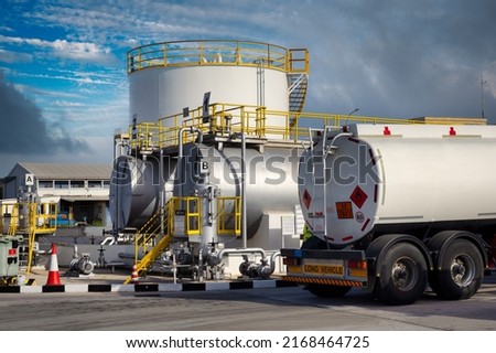 Equipment of the fuel terminal of the international airport. Jet A1 fuel transfer pumps, tanker and stored fuel tanks, firefighting equipment and filling station Royalty-Free Stock Photo #2168464725