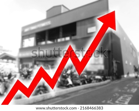 Abstract blurred image of a big red arrow growing on a background of rising house prices. Bar charts and charts. Food prices rose. Inflation concept. retail. finance. stock market. shop.
