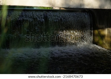 Old dam on the river. waterfall water