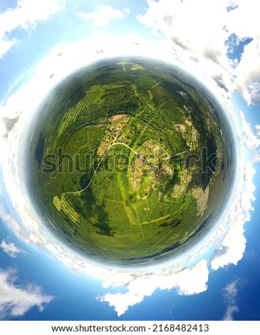 little planet style picture of lsmall village in woods  Nature background