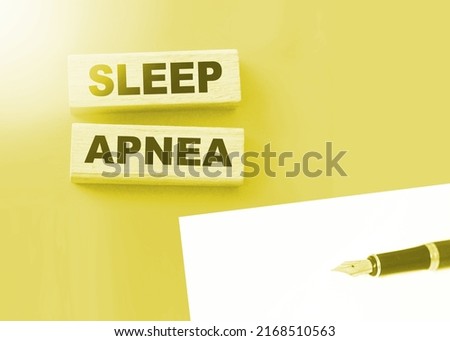 Sleep apnea words on wooden blocks. Sleep disorders healthcare concept.