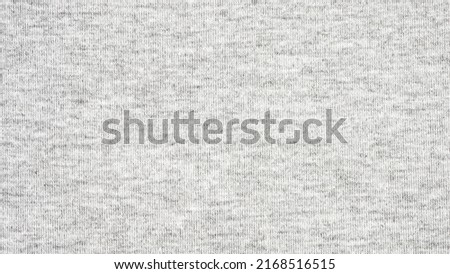 Close up gray cotton heather texture background.  
Black and white texture knit fabric pattern seamless.
Selective focus.
top view. Royalty-Free Stock Photo #2168516515