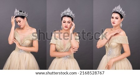 Half Body young adult Asian Woman, look at camera, Miss Beauty Pageant Contest wear Diamond Crown Evening Gown. Beautiful female express feeling smile happy over gray background isolated, copy space Royalty-Free Stock Photo #2168528767