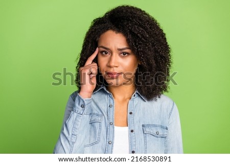 Photo of young lady finger touch head minded deep hmm intelligent isolated over green color background