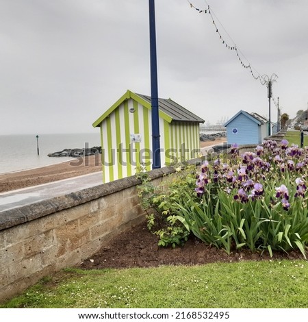 Felixstowe beach promenade with wooden beach huts during rainy cloudy May day in Felixstowe, Suffolk, East Anglia, England, united Kingdom, Europe  Royalty-Free Stock Photo #2168532495