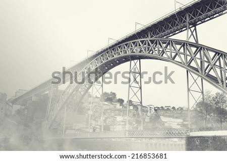 Dom Luiz bridge in the fog. Vintage picture. Porto, Portugal