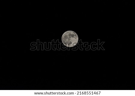 Super full Moon in Dark sky from Himalayas. Uttarakhand, India, Asia. Black and White Photography.