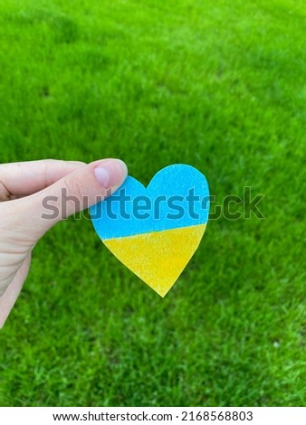 Concept of ending the war in Ukraine. Flag shape heart.