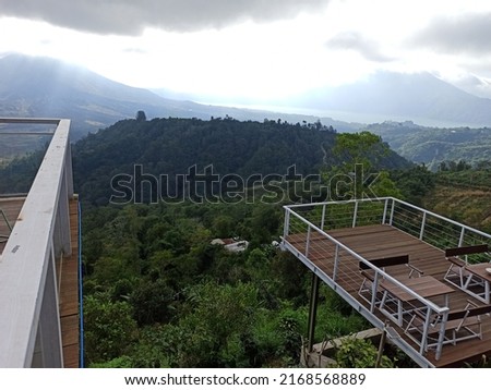 Wooden decking, serves as a floor covering or as a base for the outside of the room, made of selected woods that are considered to be able to withstand changes in weather, heat, cold, and other. Royalty-Free Stock Photo #2168568889