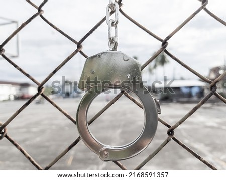 The metal shackles in the old prison had no freedom. Royalty-Free Stock Photo #2168591357