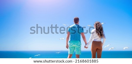 Banner of couple in love embracing on sea beach, couple. Vacation summer horizontal Banner. Couple on the tropical beach, Back view man and woman watching the seaside. Holiday travel background.