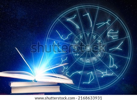 Books, illustration of zodiac wheel with astrological signs and starry sky at night