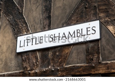 Close-up of the street sign for Little Shambles, in the historic city of York, UK.