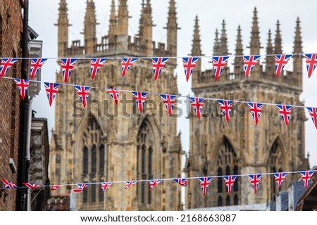 Union flag bunting hanging in the beautiful city of York, in the UK. The historic York Minster pictured in the background.