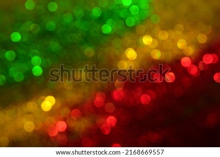 Black History Month concept. Abstract green yellow and red color glitter sparkle background. Space for your text. Flat lay.