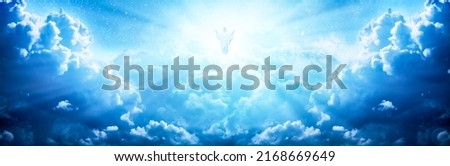 Jesus Christ In The Clouds Of Heaven With Brilliant Light - Ascension  Christ Return Royalty-Free Stock Photo #2168669649