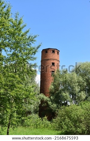 Old round red brick water tower