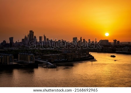 Panorama of the London skyline with river Thames during a fiery summer sunset, England Royalty-Free Stock Photo #2168692965
