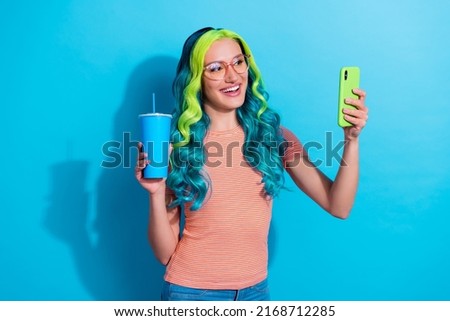 Photo of young good mood young blogger girl take selfie have online stream with subscribers isolated on blue color background