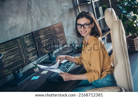 Profile side view portrait of attractive cheerful smart clever girl geek developing web company research at workplace workstation indoors