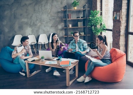 Photo of good mood positive best friends students at dorm discuss their homework sitting in college library room