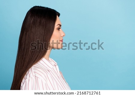 Profile side view portrait of attractive content long-haired girl copy blank space isolated over blue pastel color background
