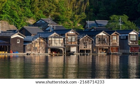 Lined up boathouses at Ine Town in Kyoto, Japan Royalty-Free Stock Photo #2168714233