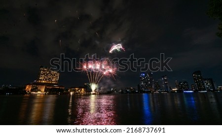 fireworks on the river in the dark sky