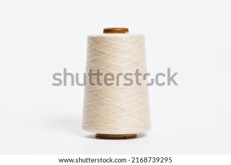 Linen and silk yarn bobbins isolated on white background Royalty-Free Stock Photo #2168739295