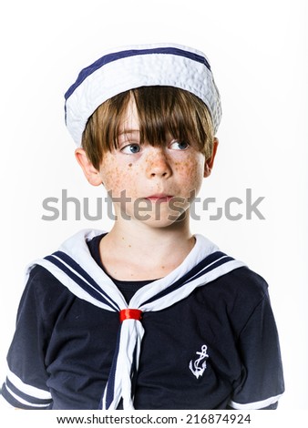 Cute little carroty boy dressed in sailor suit
