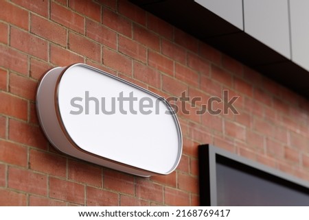 Wall signage logo mockup whit blank screen
