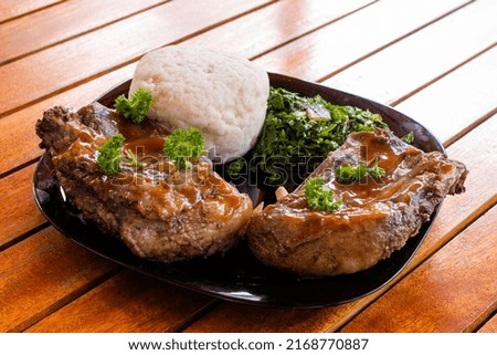 Kenya African Dishes Meals Foods On The Table Ugali Sukumawiki and fried meat  Royalty-Free Stock Photo #2168770887